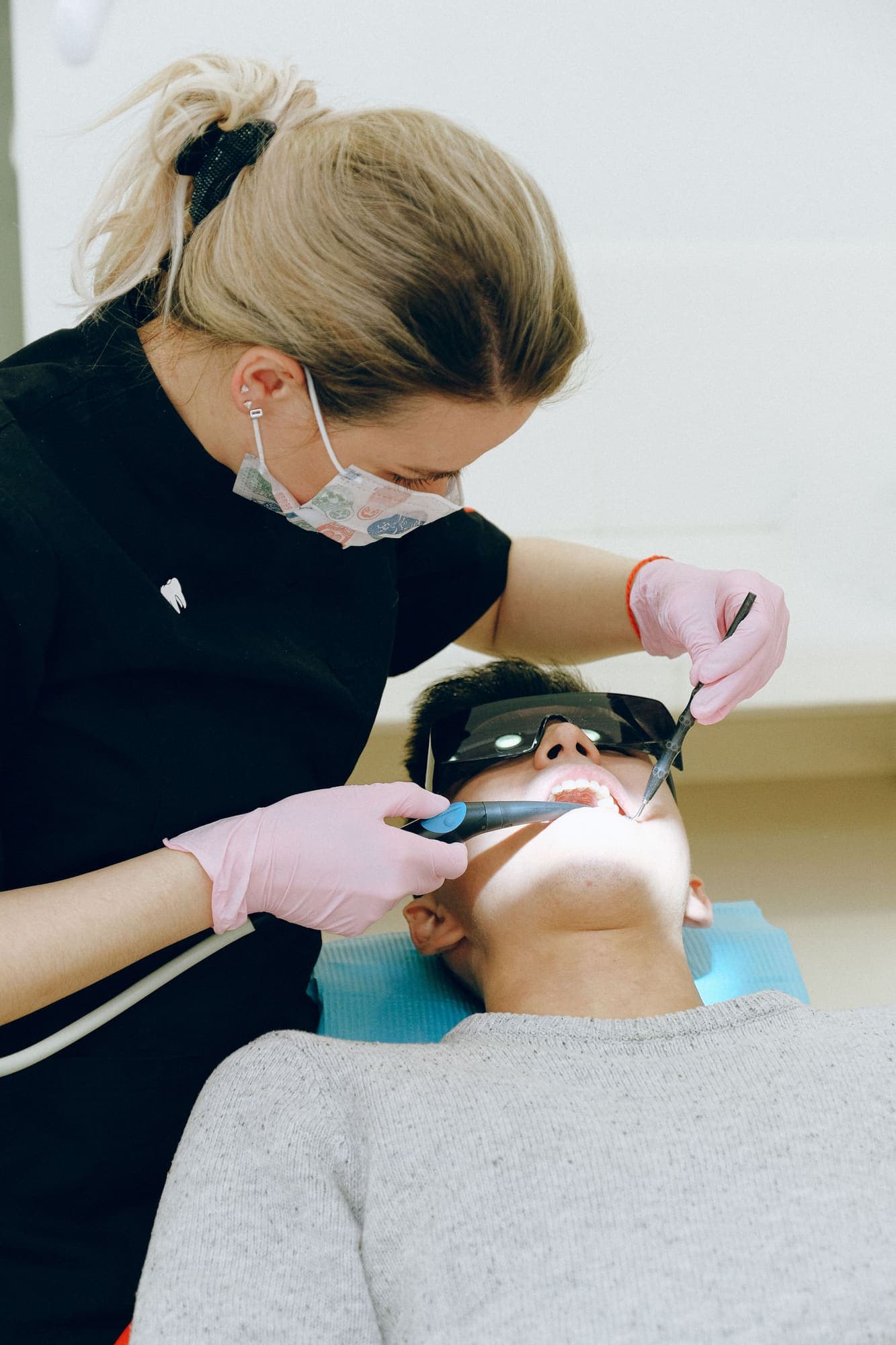 A dentist reviews findings with a patient during a routine dental consultation.